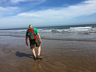Dipping boots in the North Sea at the start of the Coast-to-Coast walk