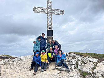 Group at summit cross