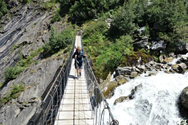 Crossing suspension bridge on the Tour du Mont Blanc
